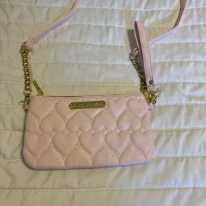 Pink heart Betsy Johnson bag with charger inside